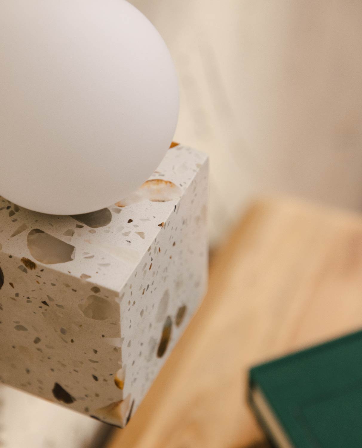 Size comparison of the two available Lunas Terrazzo Cube Wall Sconce options.