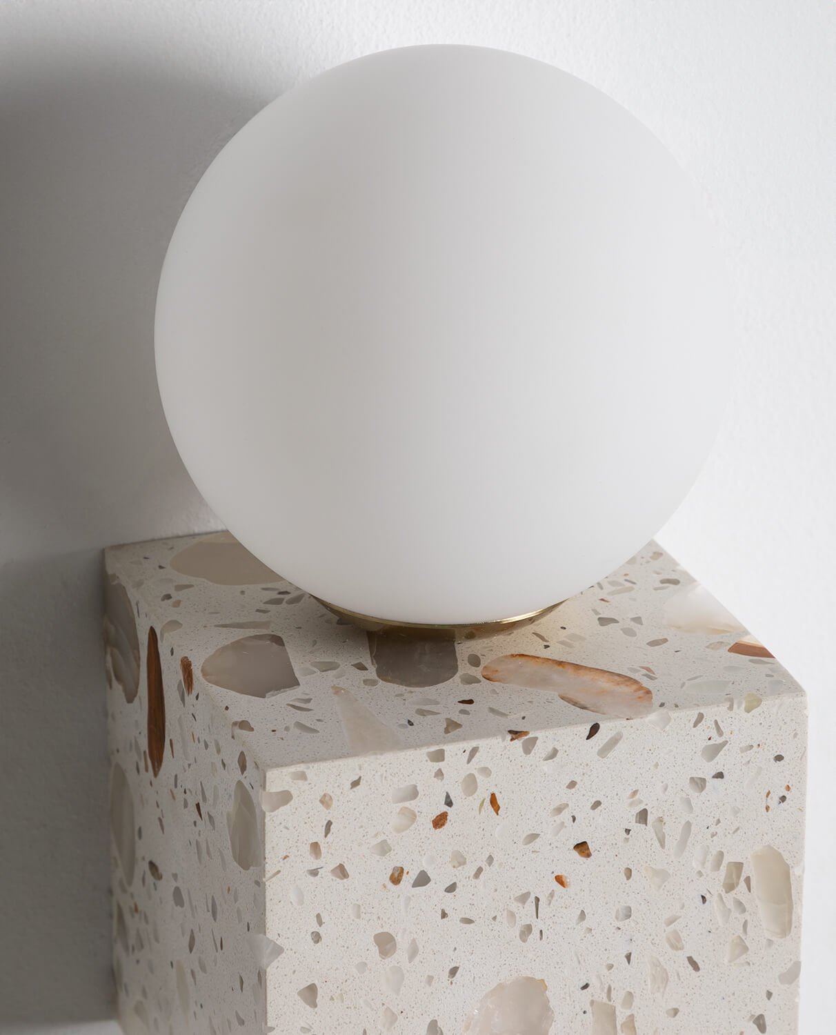 Lifestyle image of the sconce in a minimalist living room.