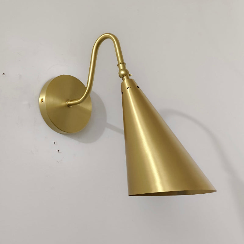Comparison of the brass, black, and chrome finishes of the Trumpet Wall Lamp.
