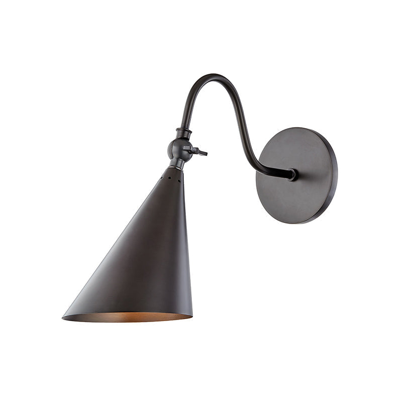 The adjustable head of the Trumpet Wall Lamp swiveled to the side.
