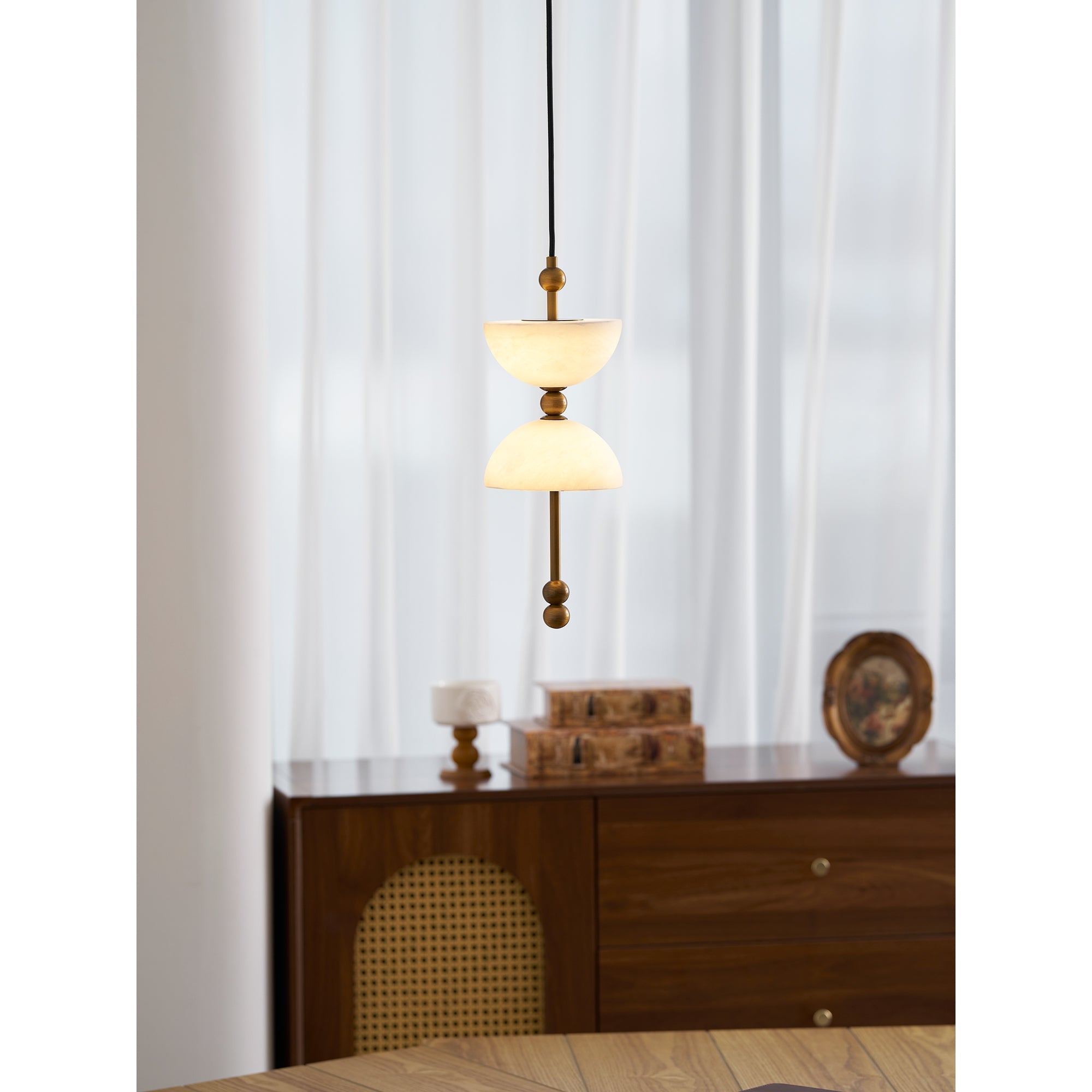 The Lyra lamp adding a touch of sophistication to a bedroom.