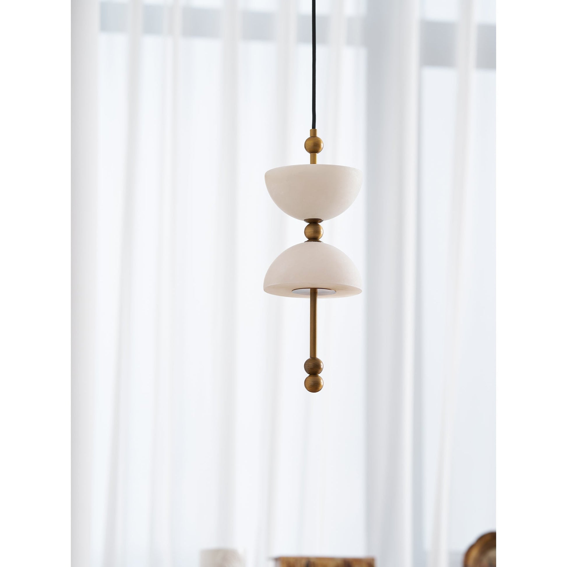 The smaller D 15cm Lyra Alabaster Pendant Lamp.