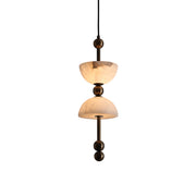 Lyra Alabaster Pendant Lamp with a warm brass body.