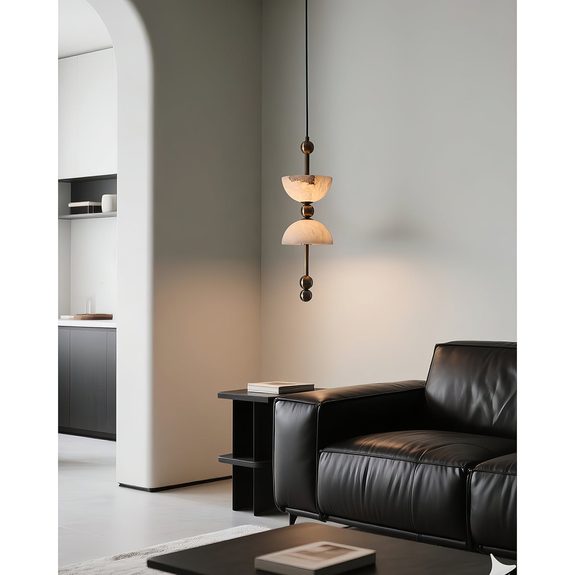 The pendant lamp hanging gracefully over a modern dining table.