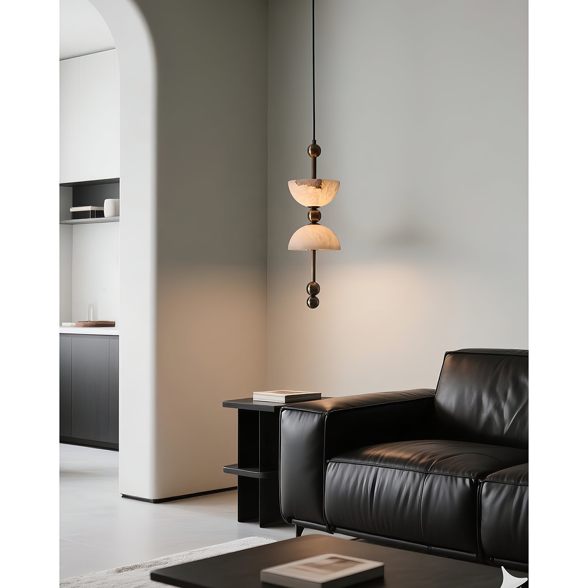 The pendant lamp hanging gracefully over a modern dining table.