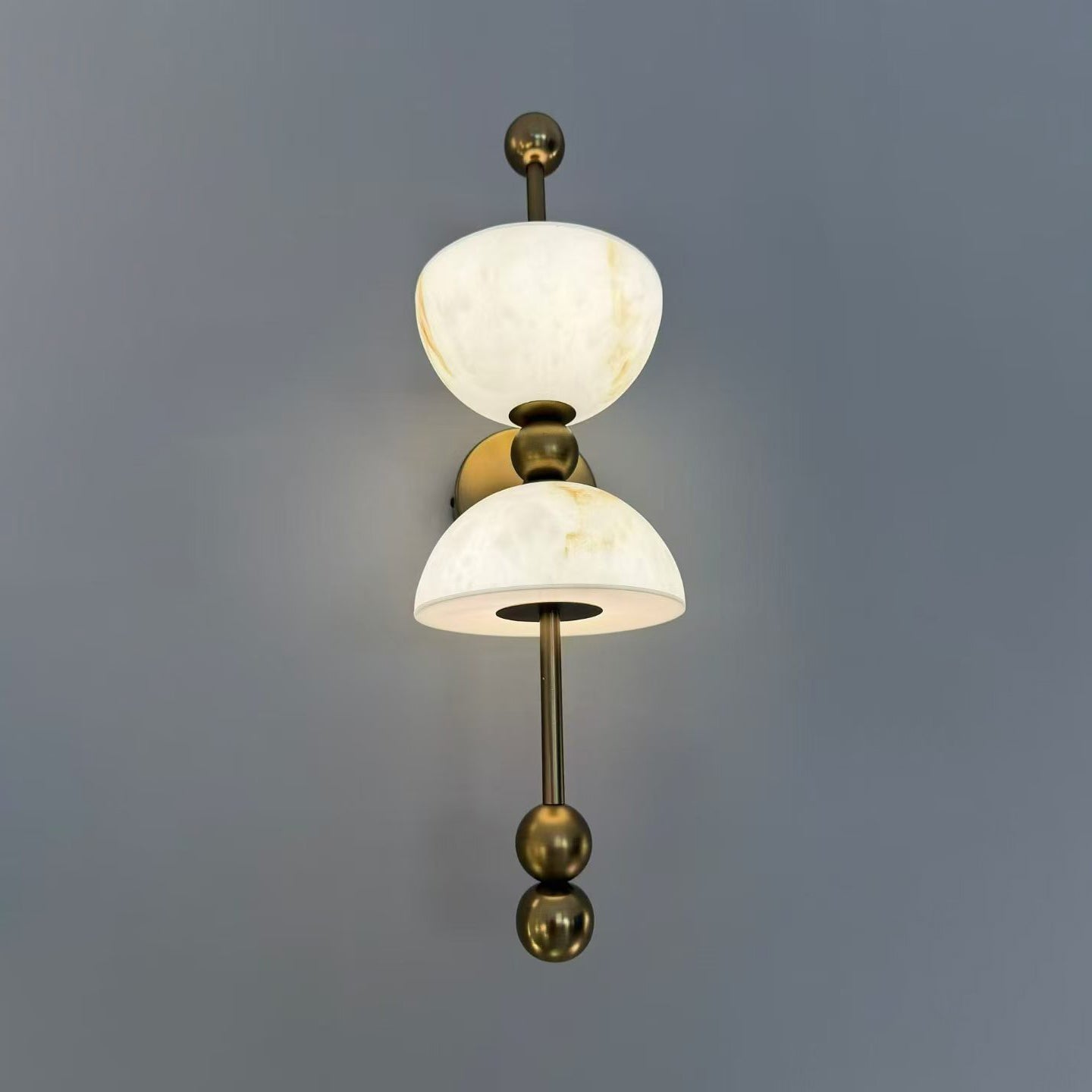 Close-up of the junction between the alabaster and brass.