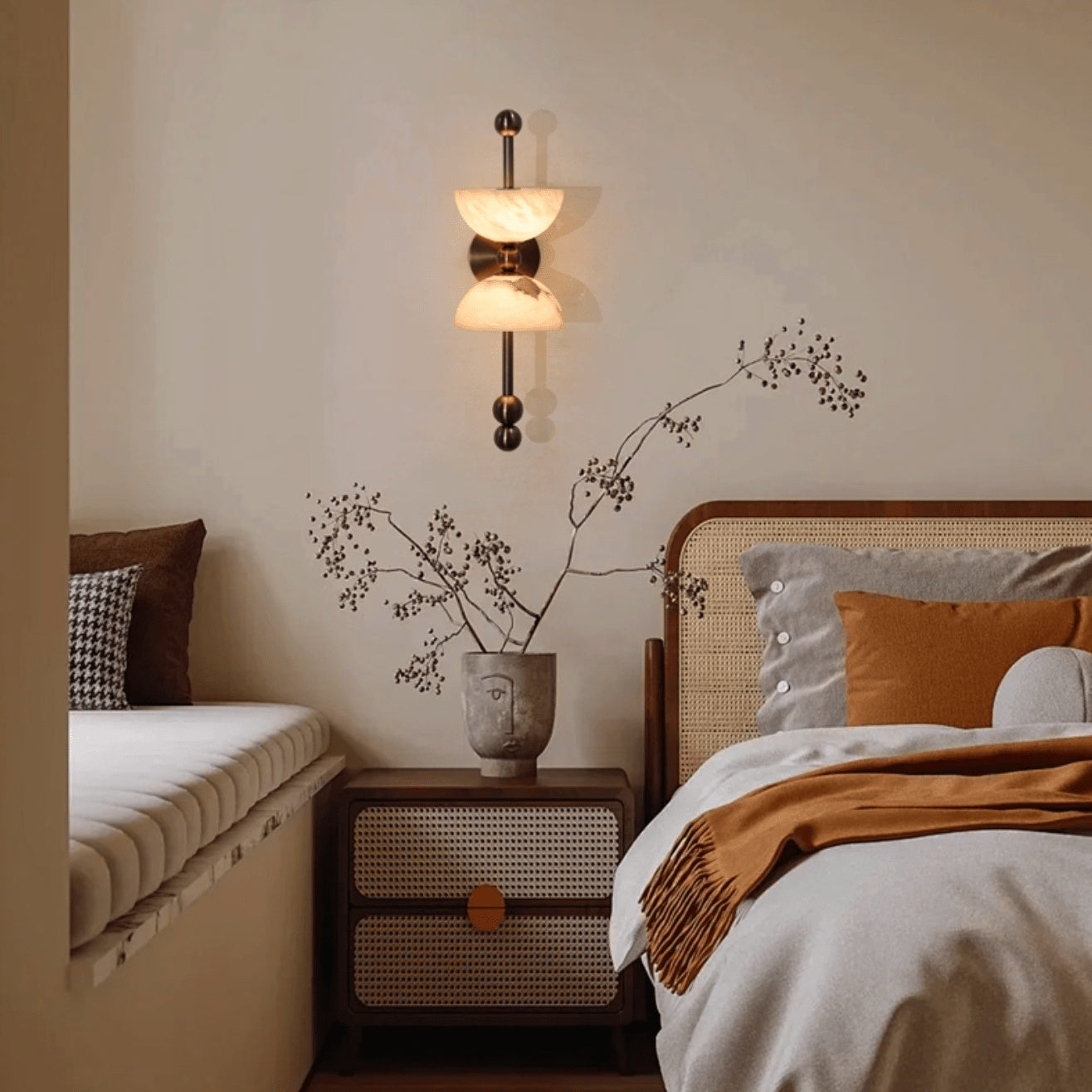 The Lyra Wall Lamp illuminated, showing its warm glow.