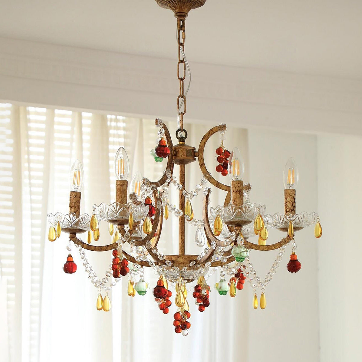 View of the chandelier from below, showing the arrangement of lights and crystals.