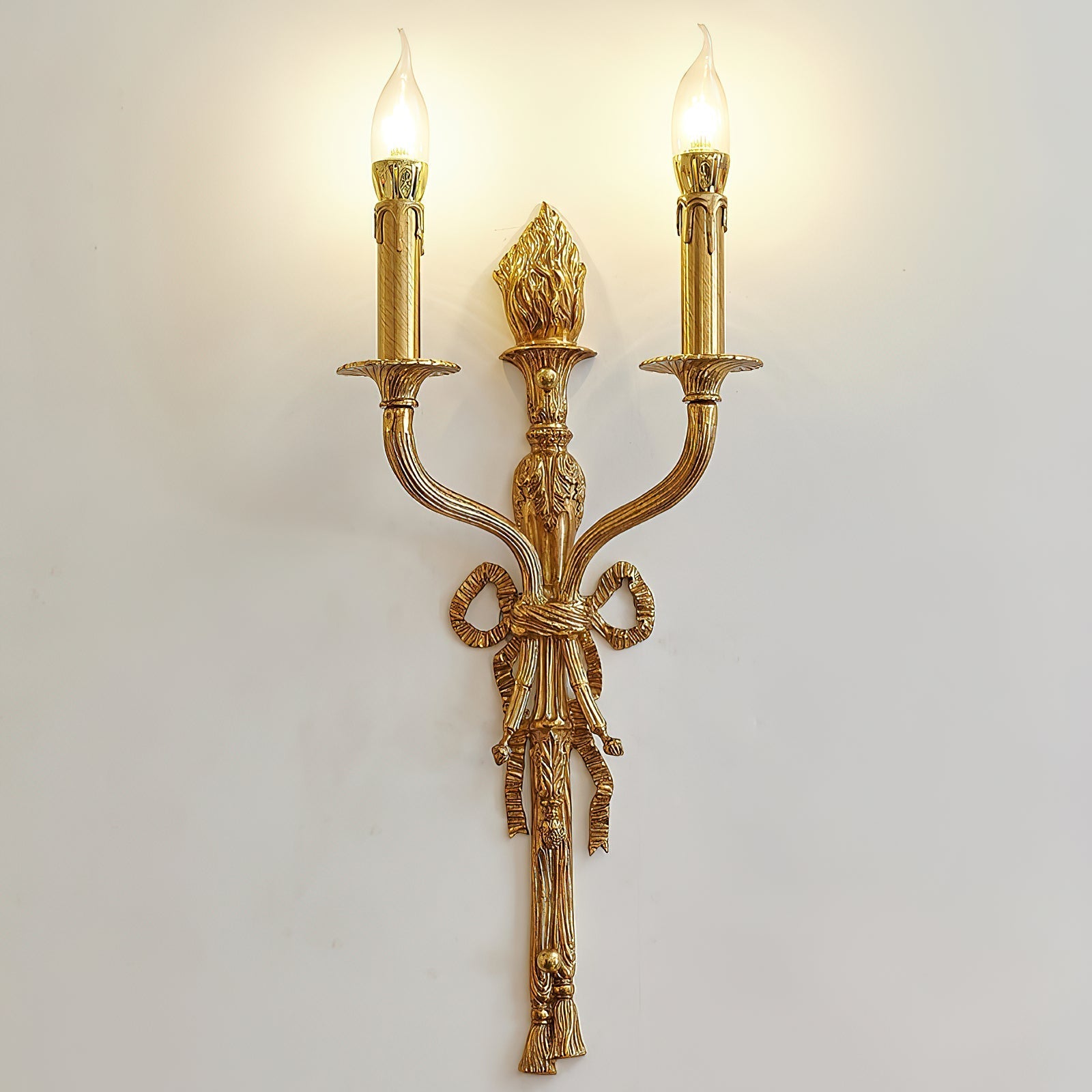The lamp shown unlit to display its brass craftsmanship.
