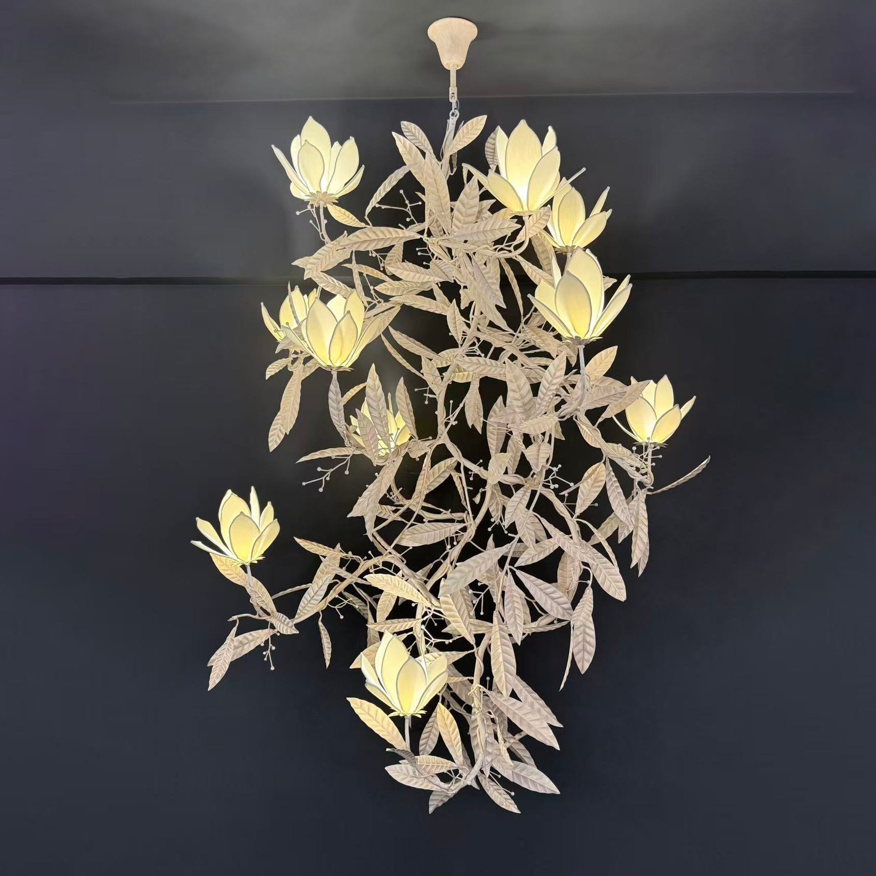 Lifestyle image of the chandelier in a high-end hotel lobby.