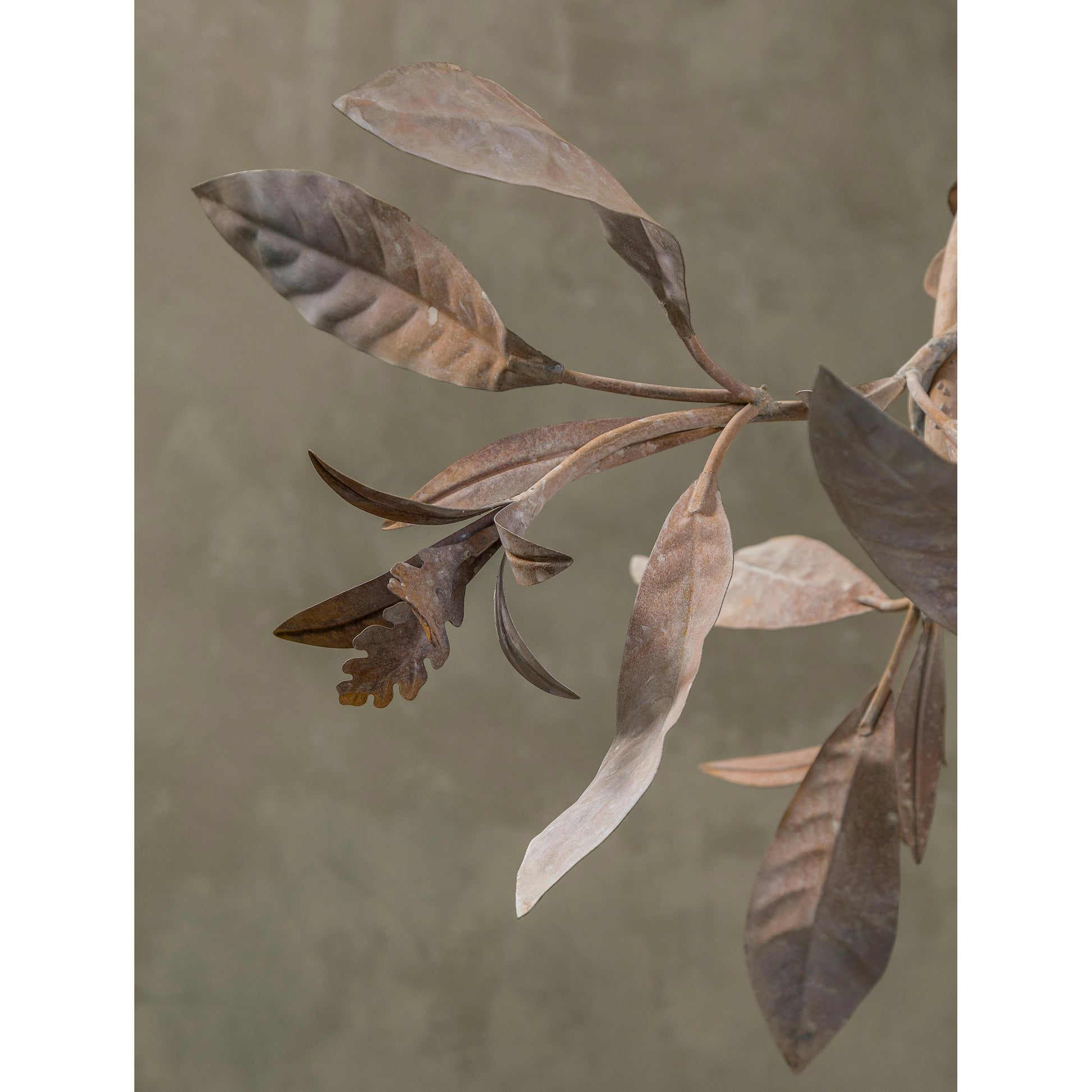 The chandelier against a dark wall, emphasizing the glowing effect of the blossoms.