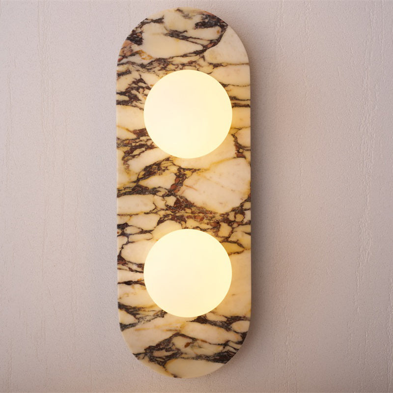 White jade wall lamp emitting a warm, diffused glow.