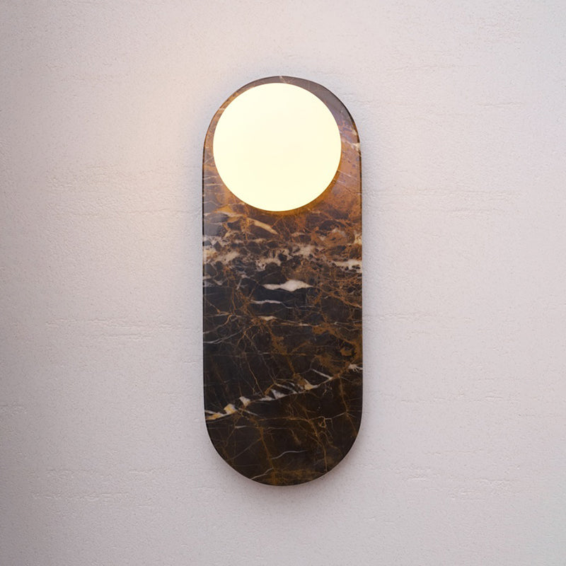 Pink marble wall lamp adding a touch of color.