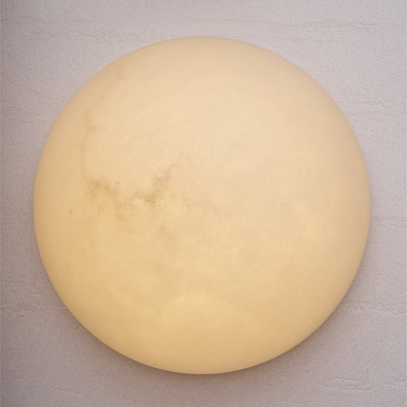 The sculptural form of the Pandora quartz wall lamp.