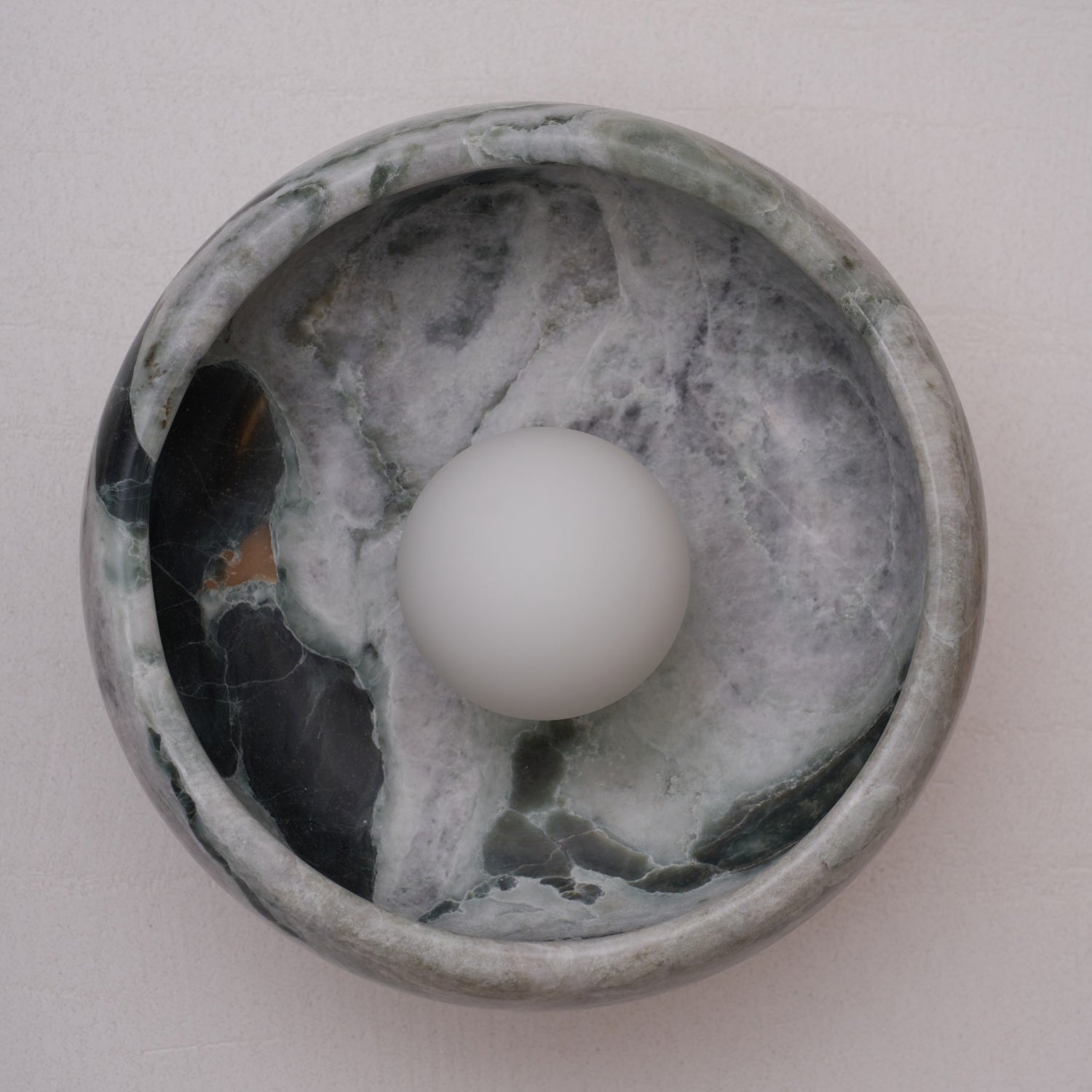 Cyan jade wall lamp, close-up on the stone.