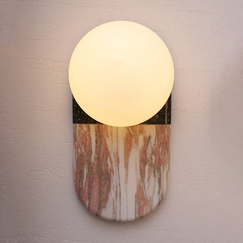 The texture of a beige travertine wall lamp.