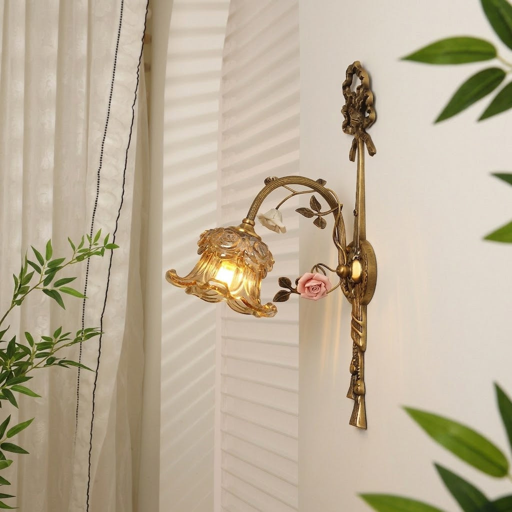 Angled view of the Margaux Fleur Wall Lamp with a Cognac shade.