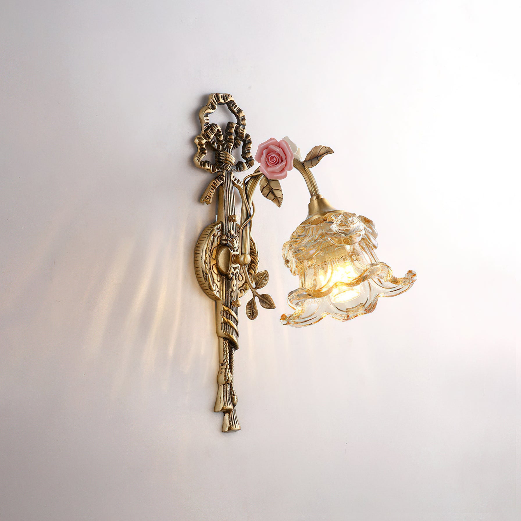 Detailed shot of the pink ceramic flower accent.