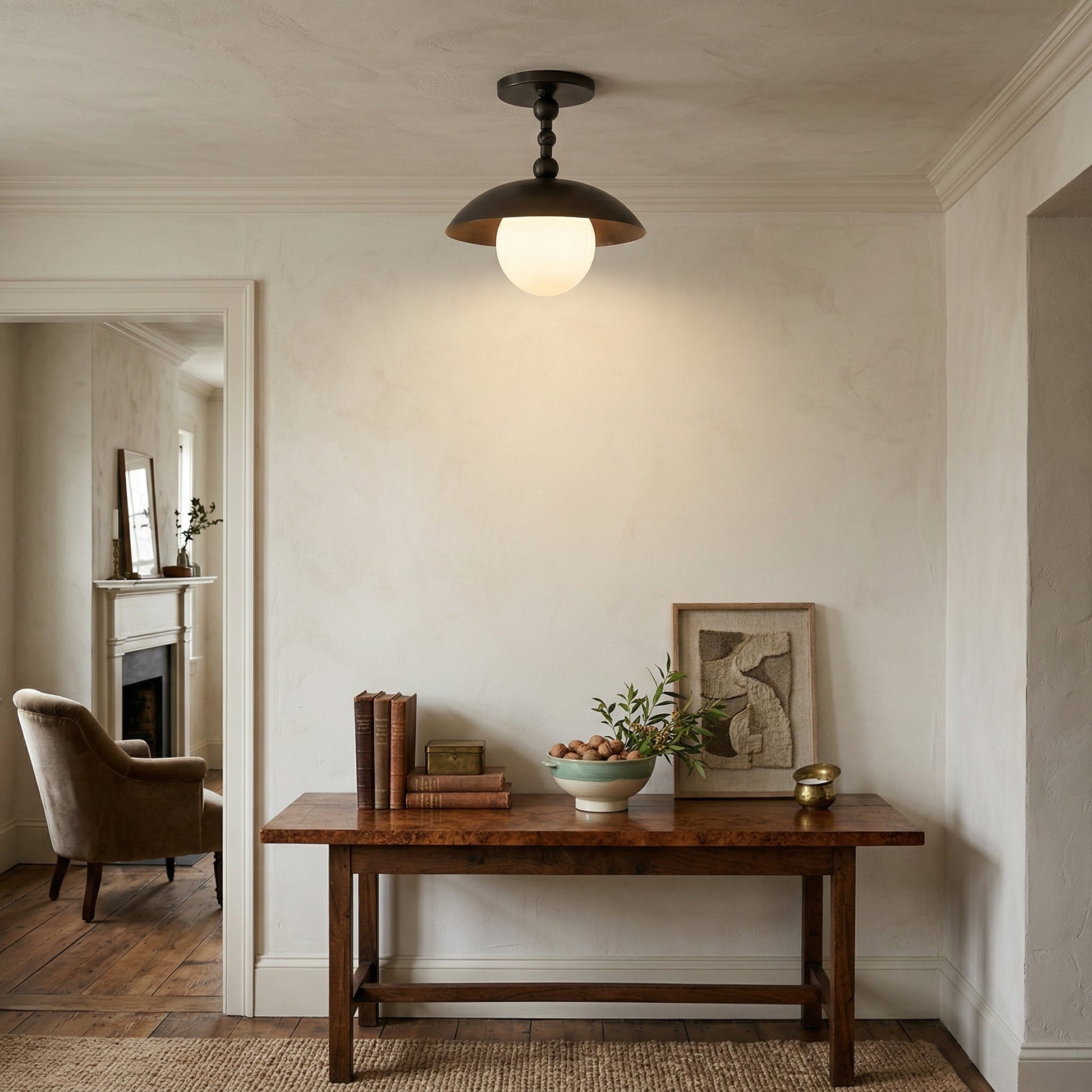 Another angle of the lamp in a hallway, showing its semi-flush profile.