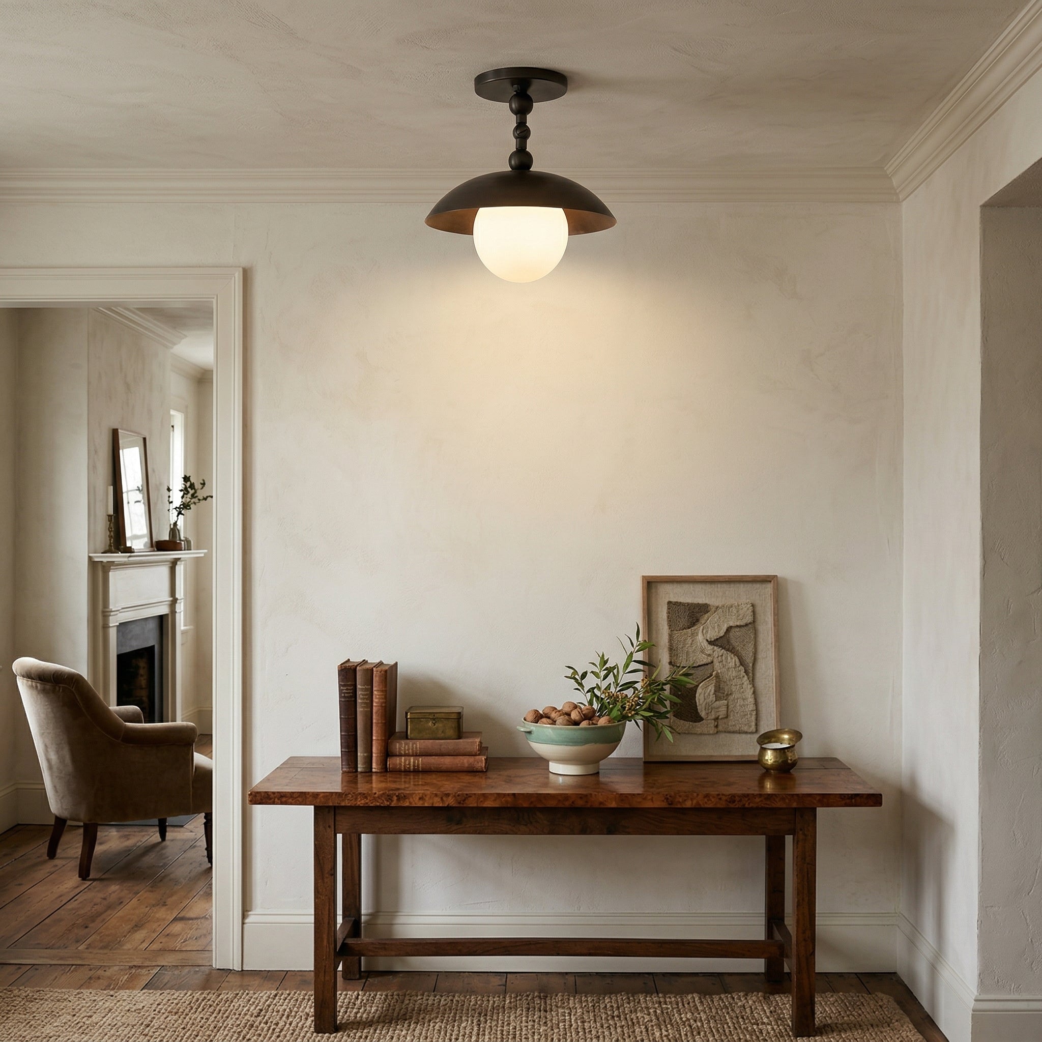 Another angle of the lamp in a hallway, showing its semi-flush profile.