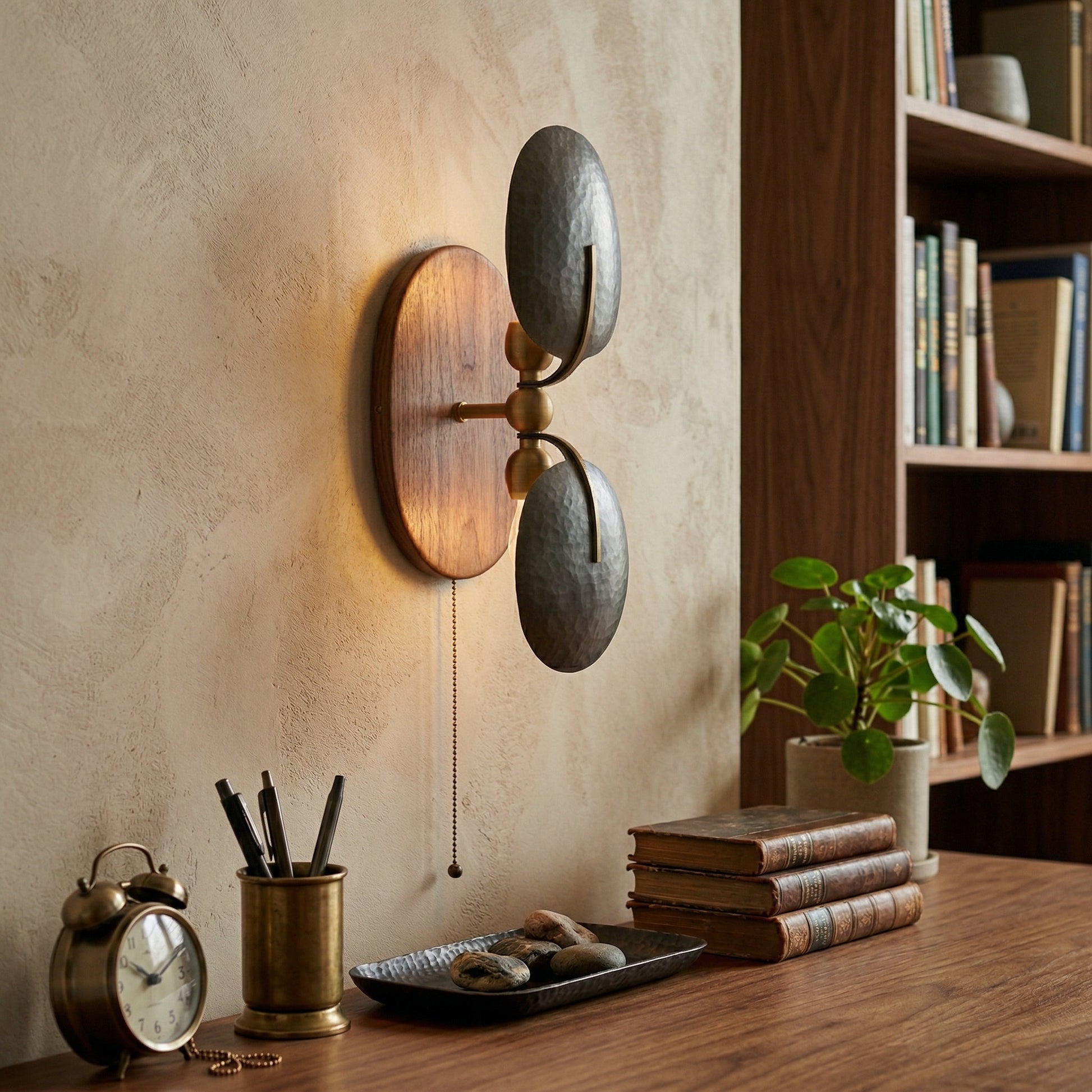 Greta Wall Lamp shown with a gold metal shade and walnut body.