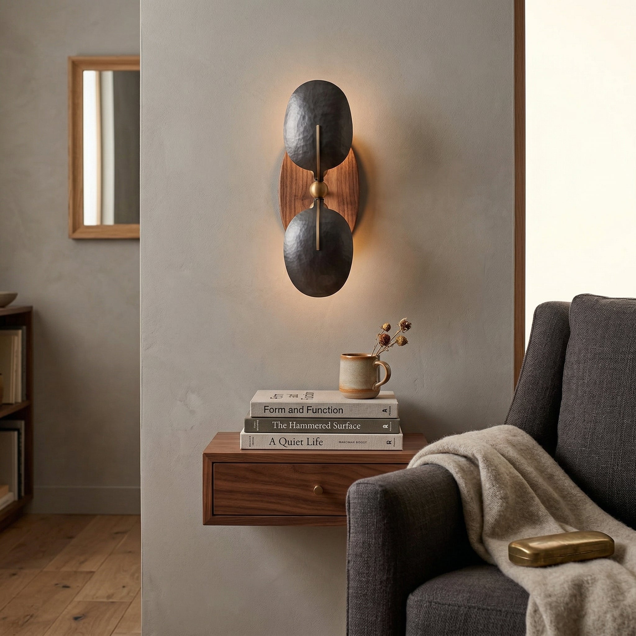 The Greta Wall Lamp installed in a contemporary living room setting.