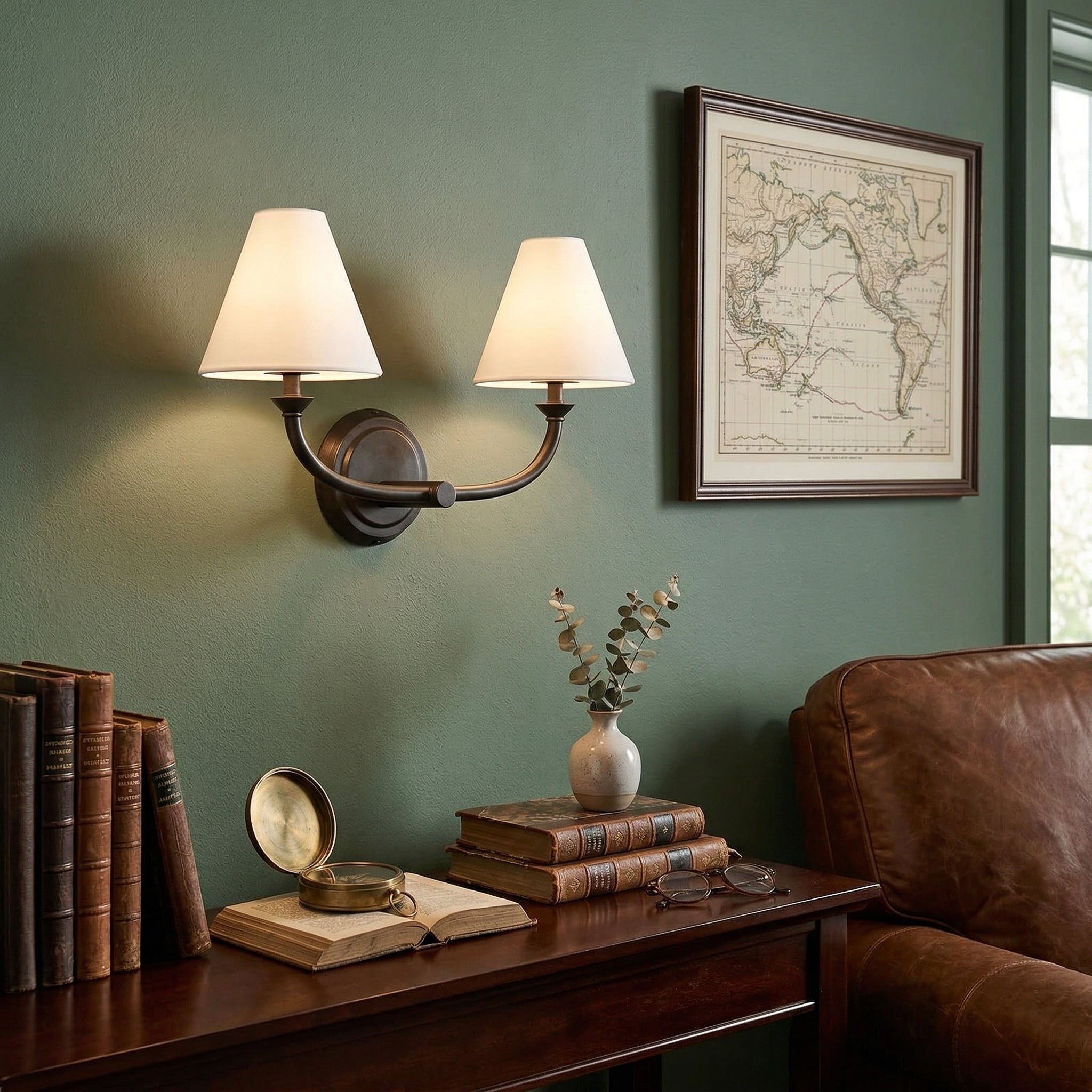 The Greta Wall Lamp shown in a sleek black finish.