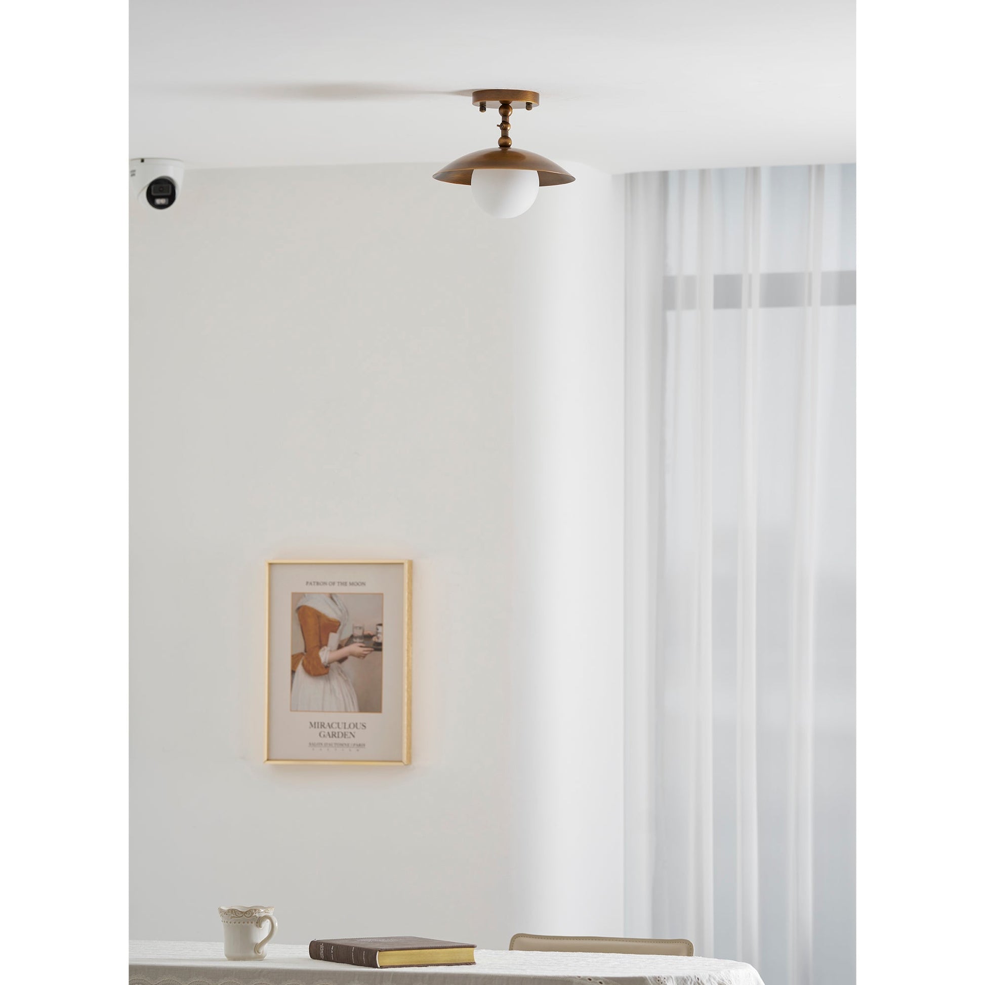 Side profile of the Marie Petite Ceiling Lamp with brass finish.
