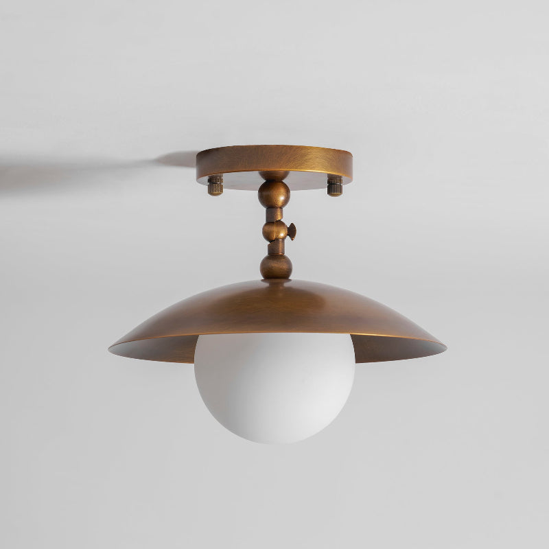 The lamp installed above a small dining nook.