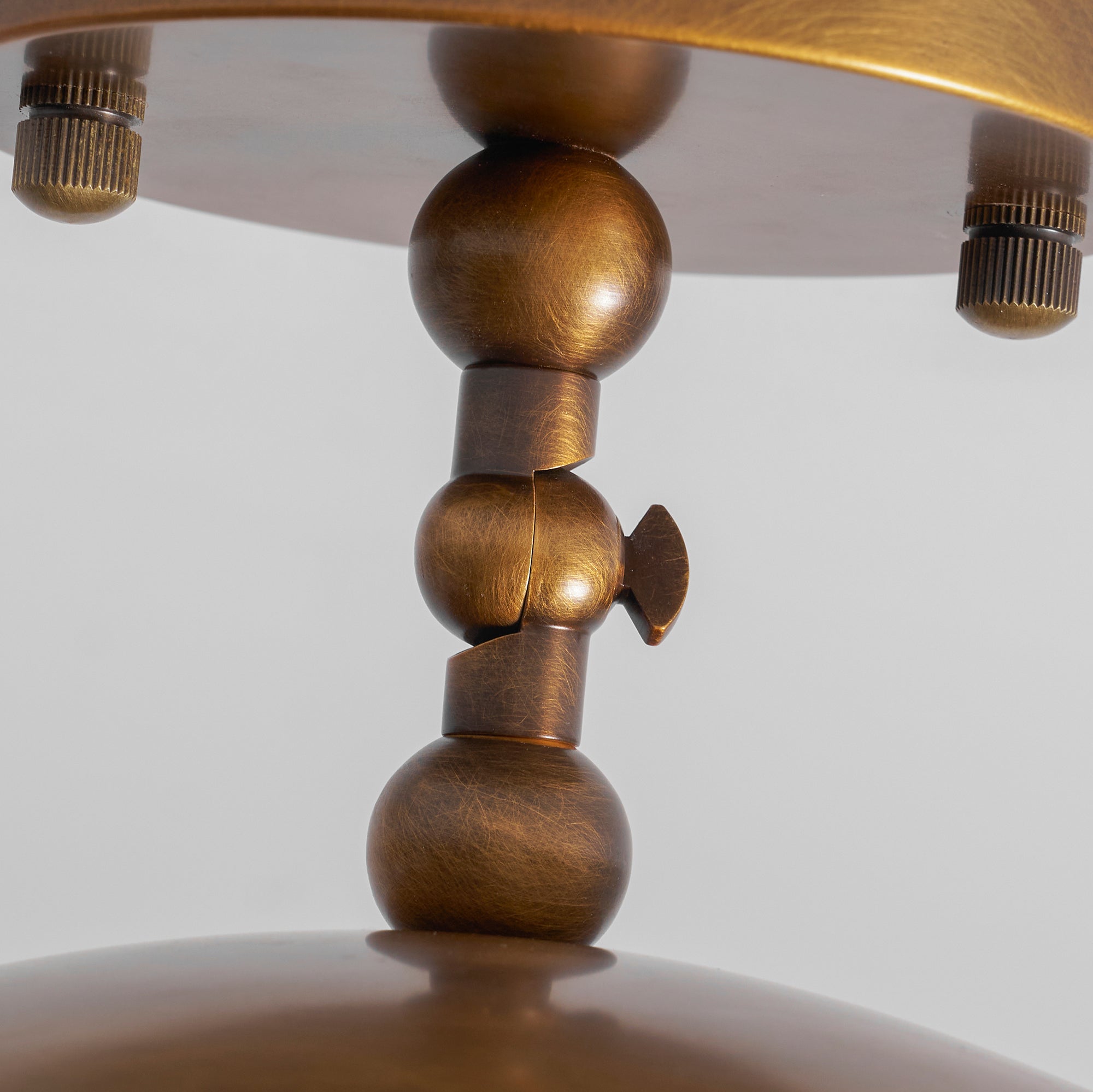Full product shot of the brass and alabaster version on a white background.