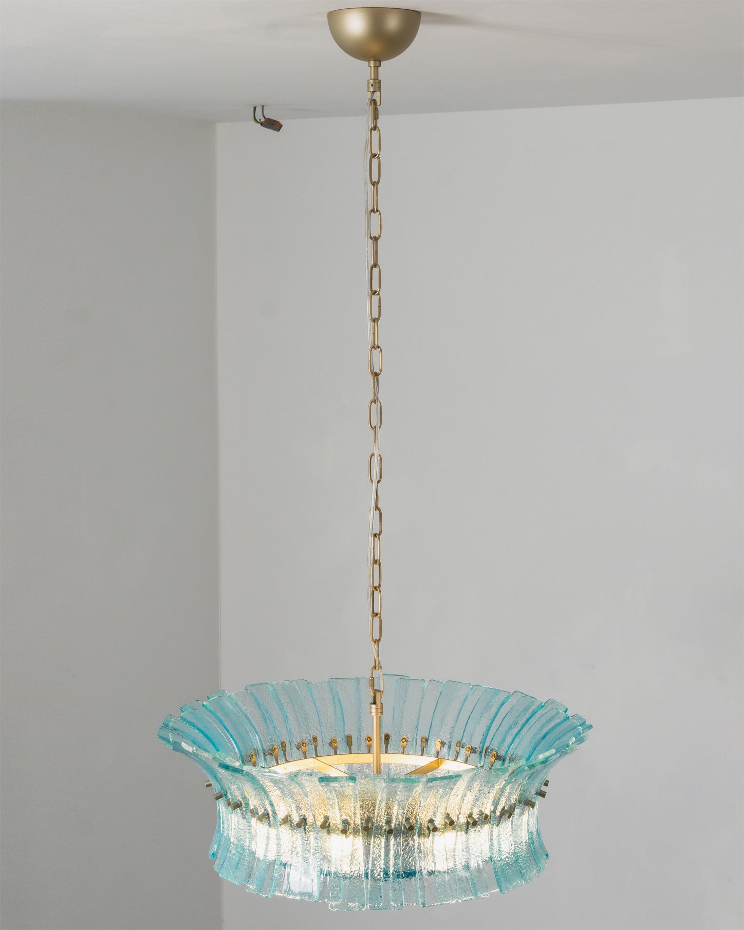 Angled view of the Marin Chandelier, emphasizing its circular shape.