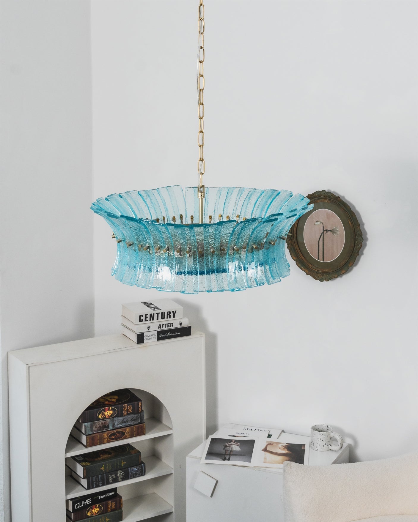 Lifestyle image of the Marin Chandelier in an upscale primary bedroom.