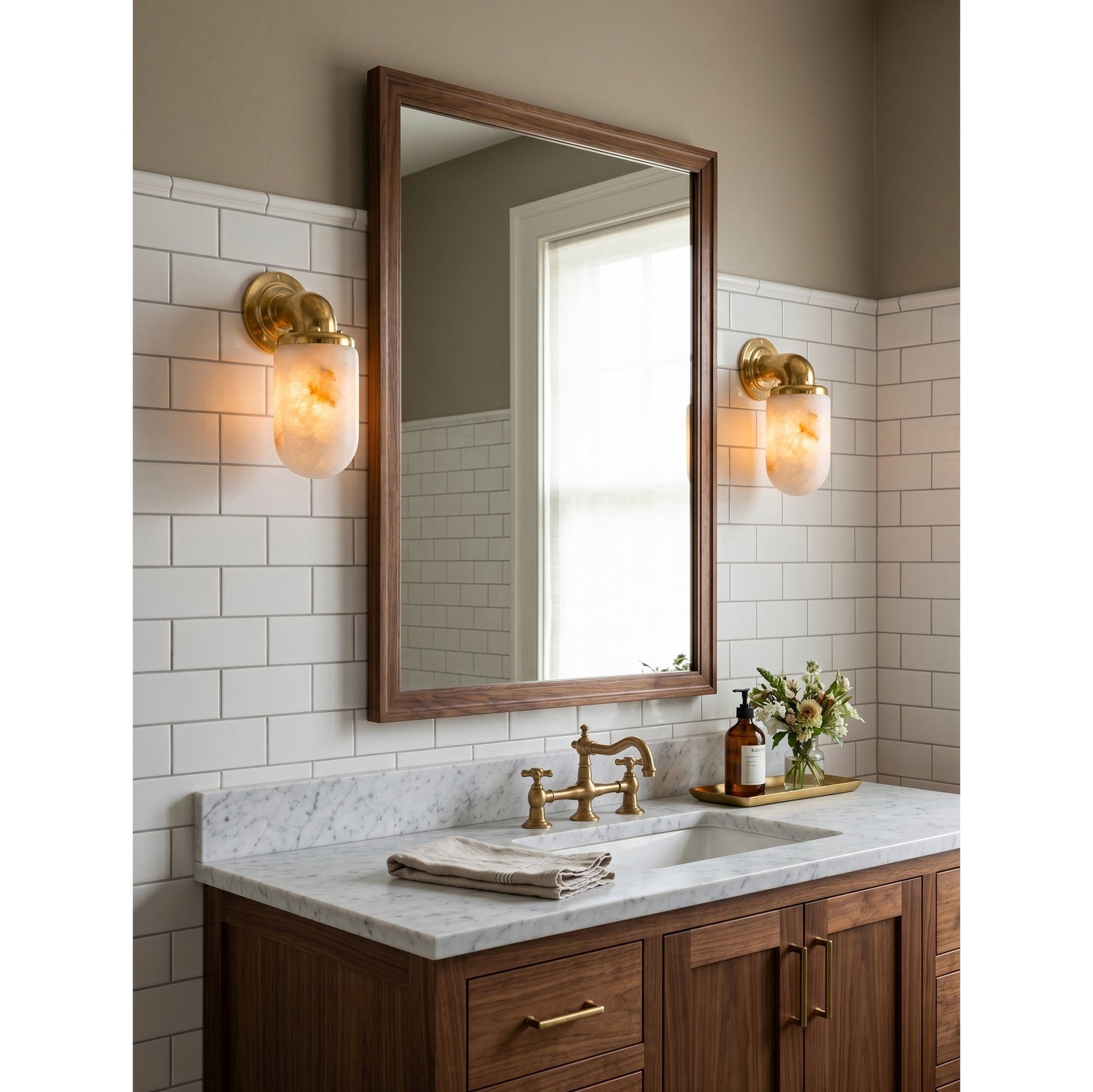 Angled view of the sconce, displaying the rounded alabaster shade.
