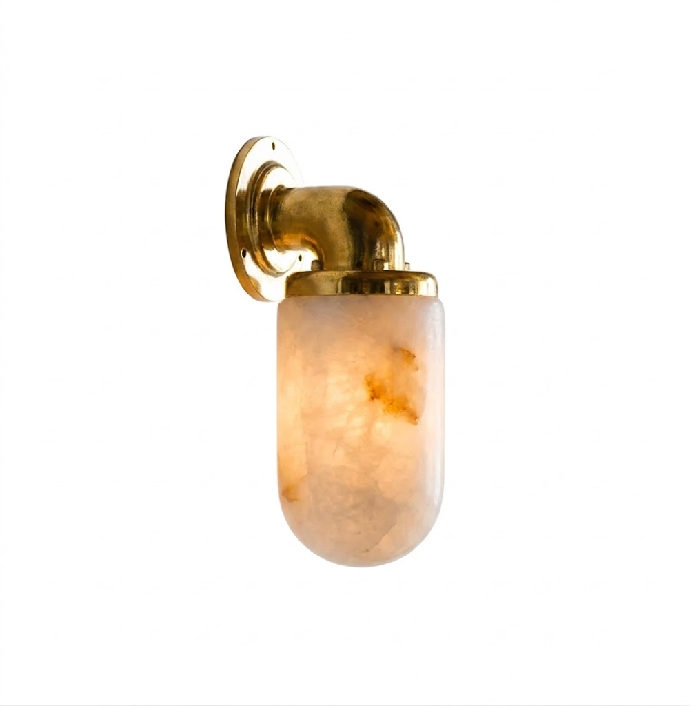 The Marine Alabaster Wall Sconce in an entryway, providing welcoming light.