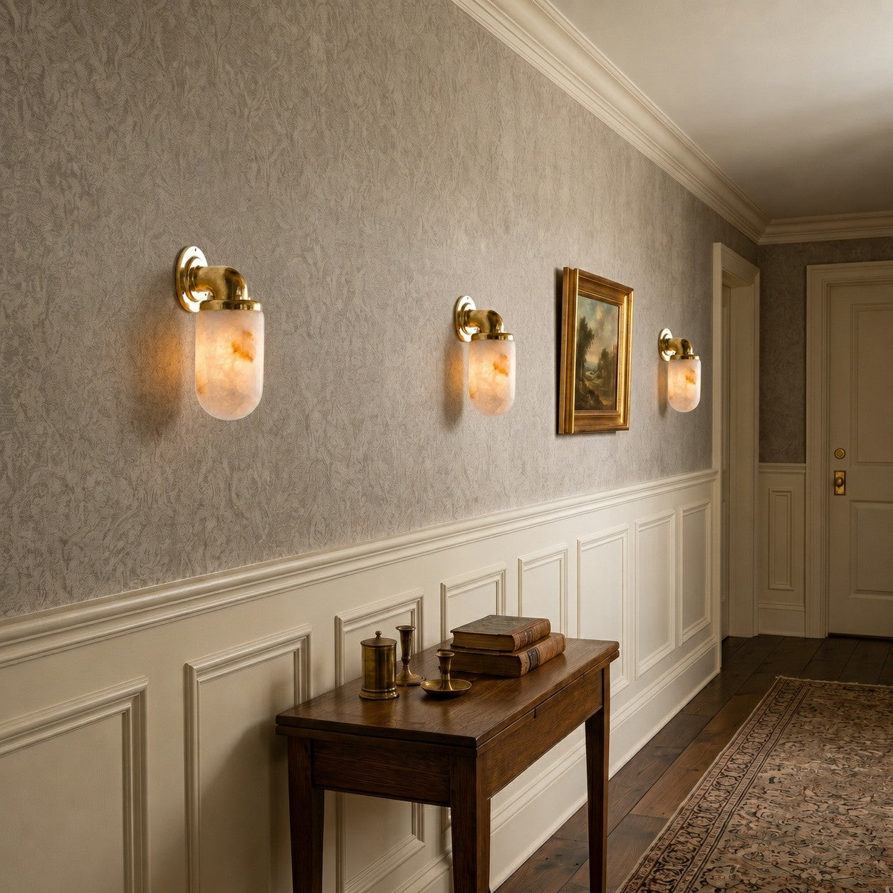 A pair of Marine Alabaster Wall Sconces flanking a bathroom mirror.