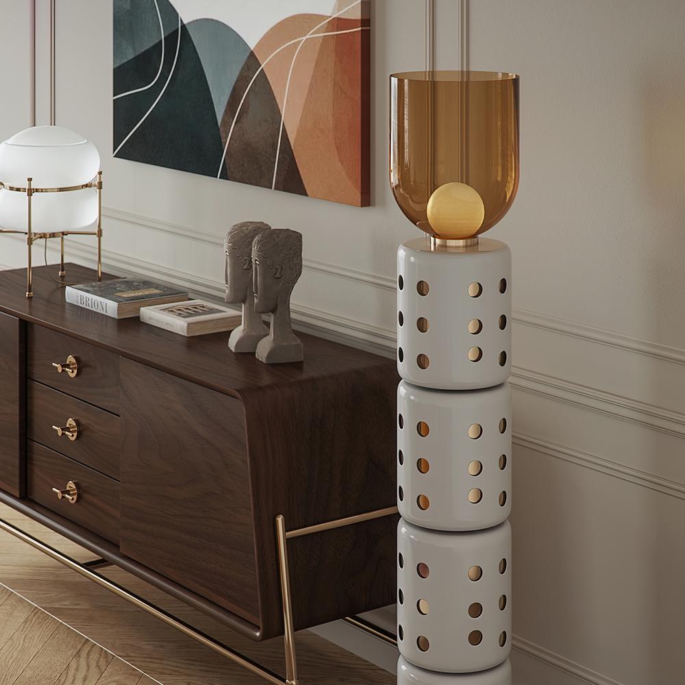 Close-up of the Marlon Floor Lamp's amber glass lampshade.