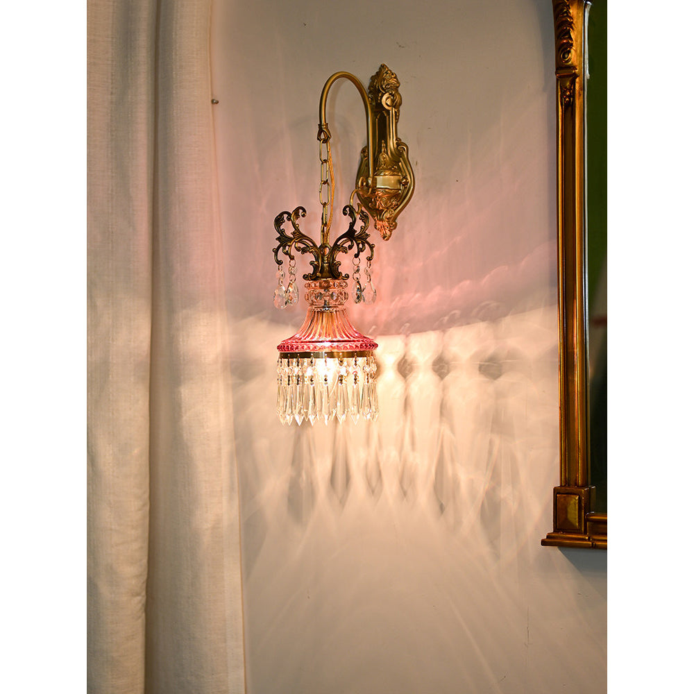 Angled view of the red crystal wall lamp.