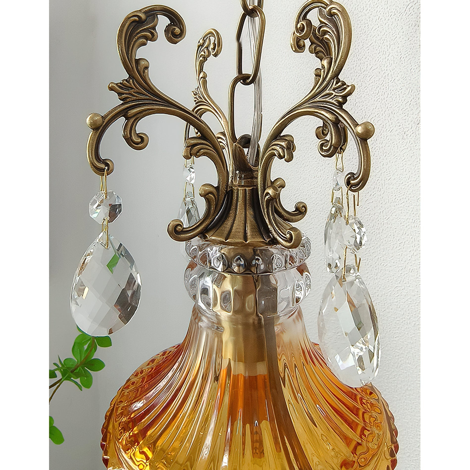 Marquise Crystal Wall Lamp, red variant, turned on.