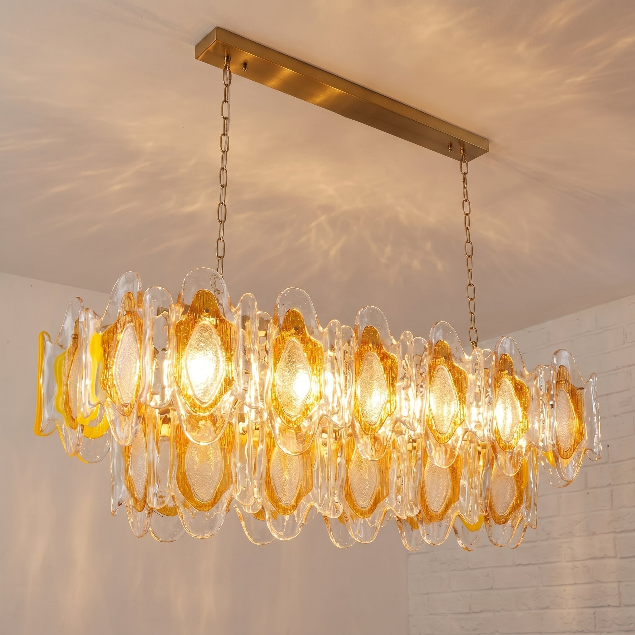 Marrina Chandelier hanging above a modern dining table.