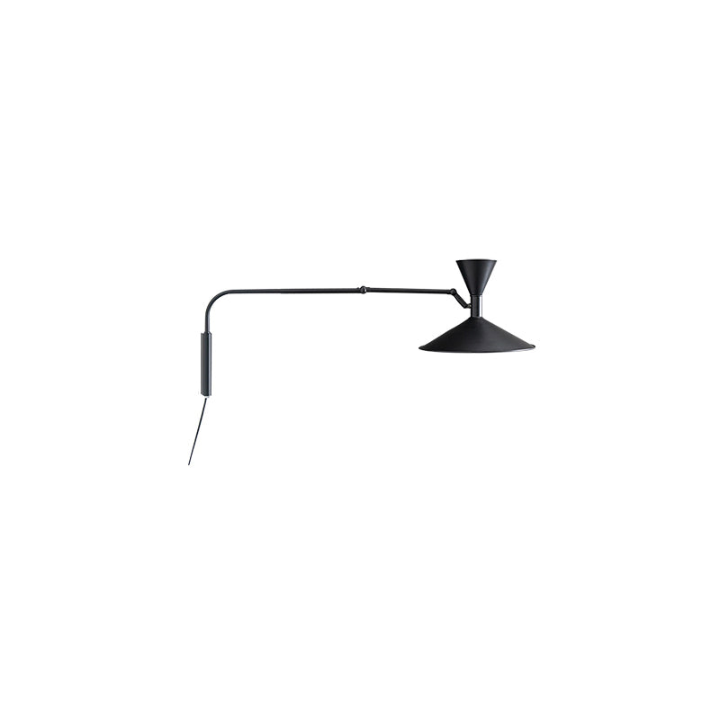 Lifestyle image of the grey sconce in a home office setting.