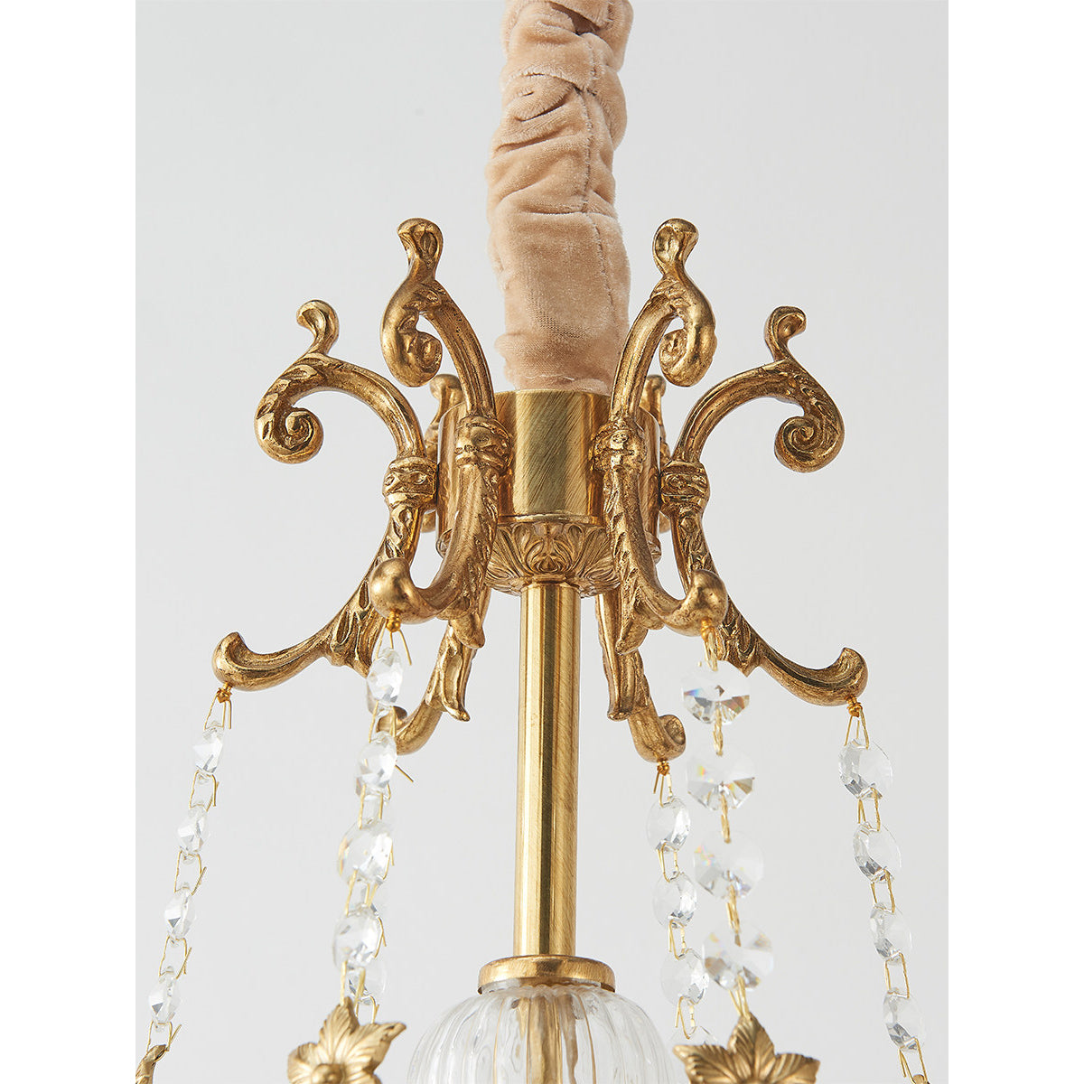 View from below looking up into the illuminated candelabra sockets.