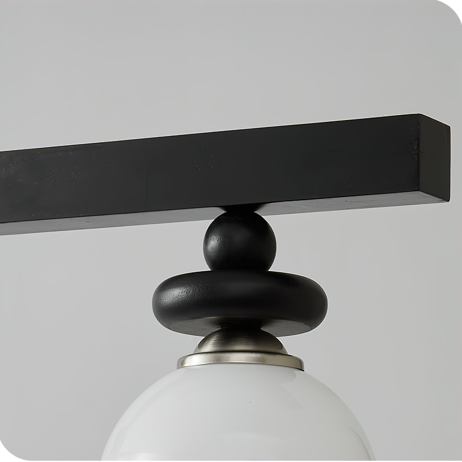 The Maru Pendant Light casting a warm, inviting glow in a darkened room.