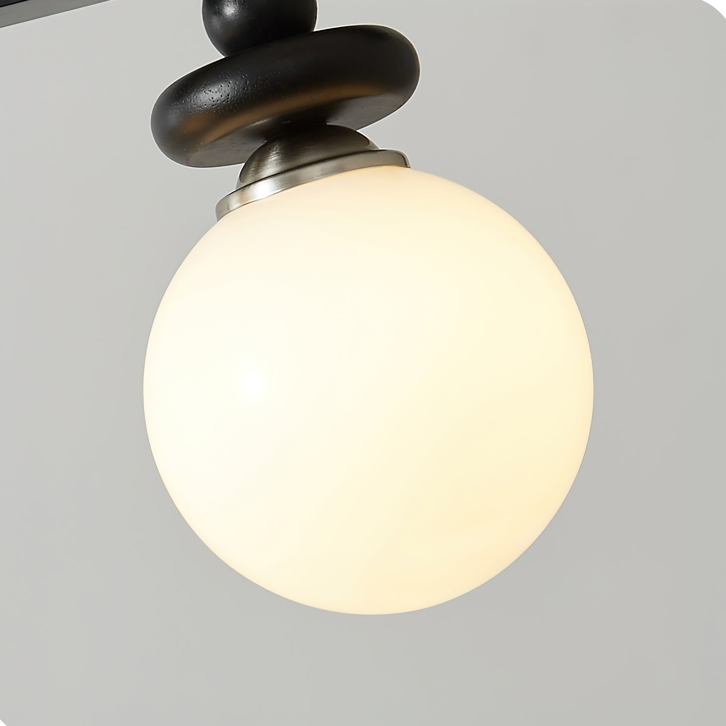 Angled shot of the single Maru Pendant Light, showing its elegant form.