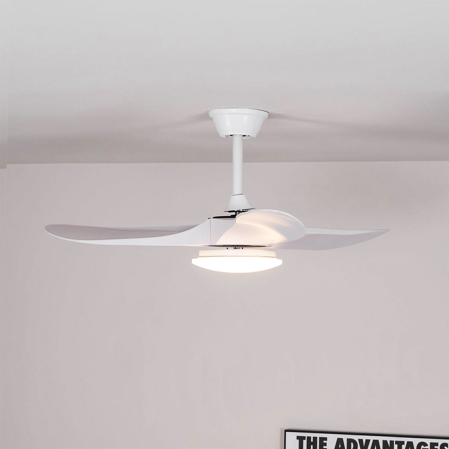 Lifestyle image of the white Maverick fan in a Scandinavian-style bedroom.
