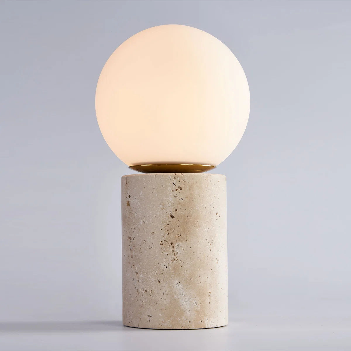 The lamp in a well-lit room, showing its form when unlit.