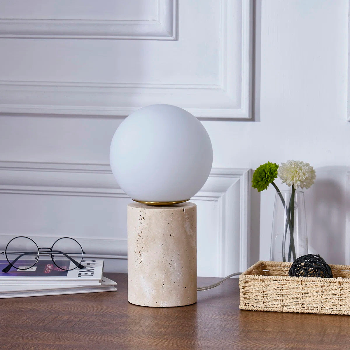 The lamp styled on a minimalist bedroom nightstand.