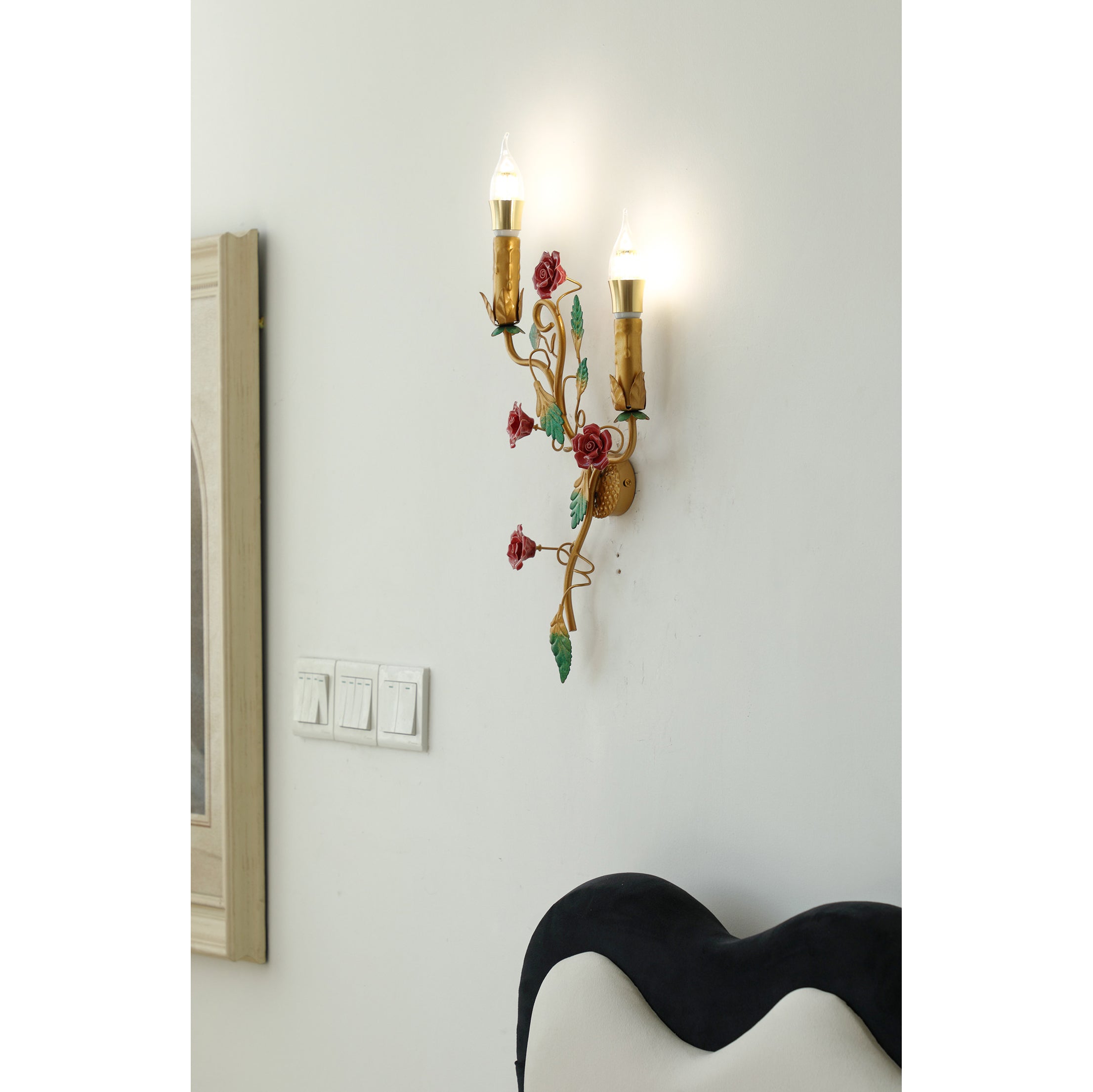 Mechini Wall Lamp shown against a dark wall.