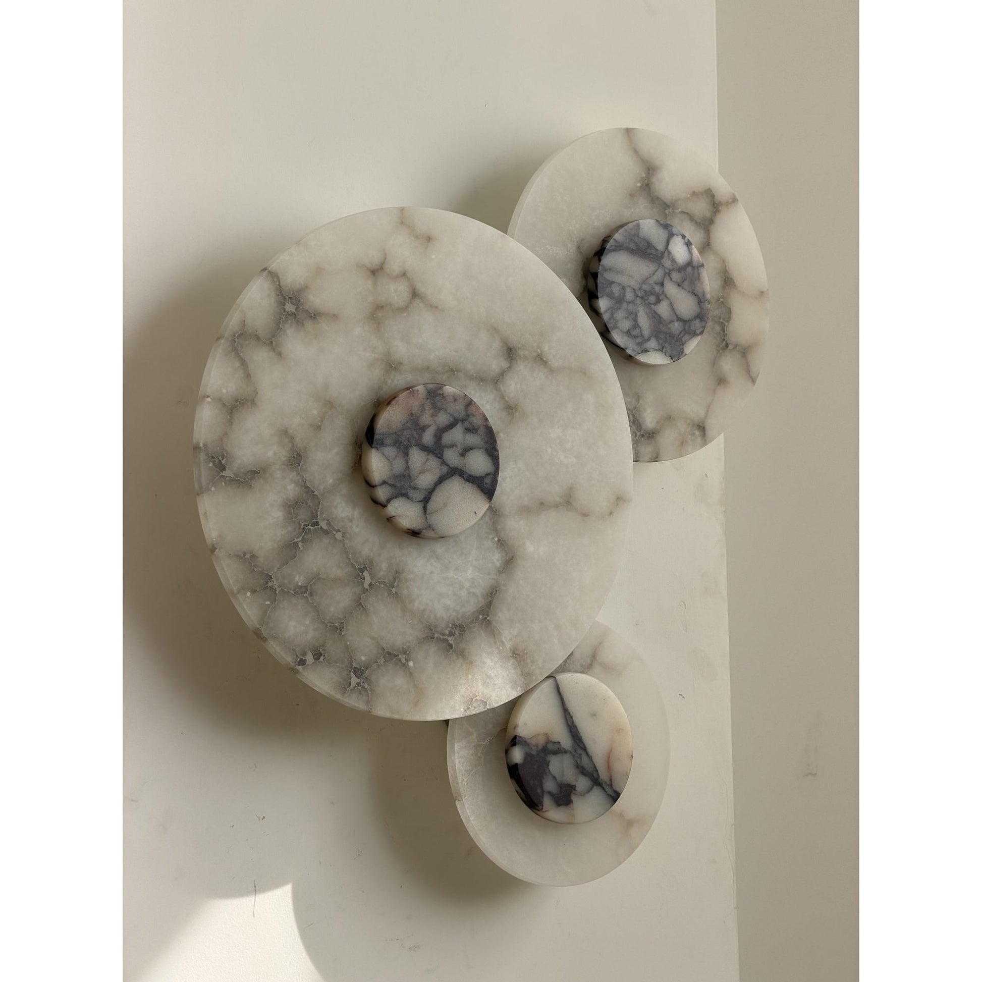 Median Wall Lamp providing soft lighting in a bedroom setting.