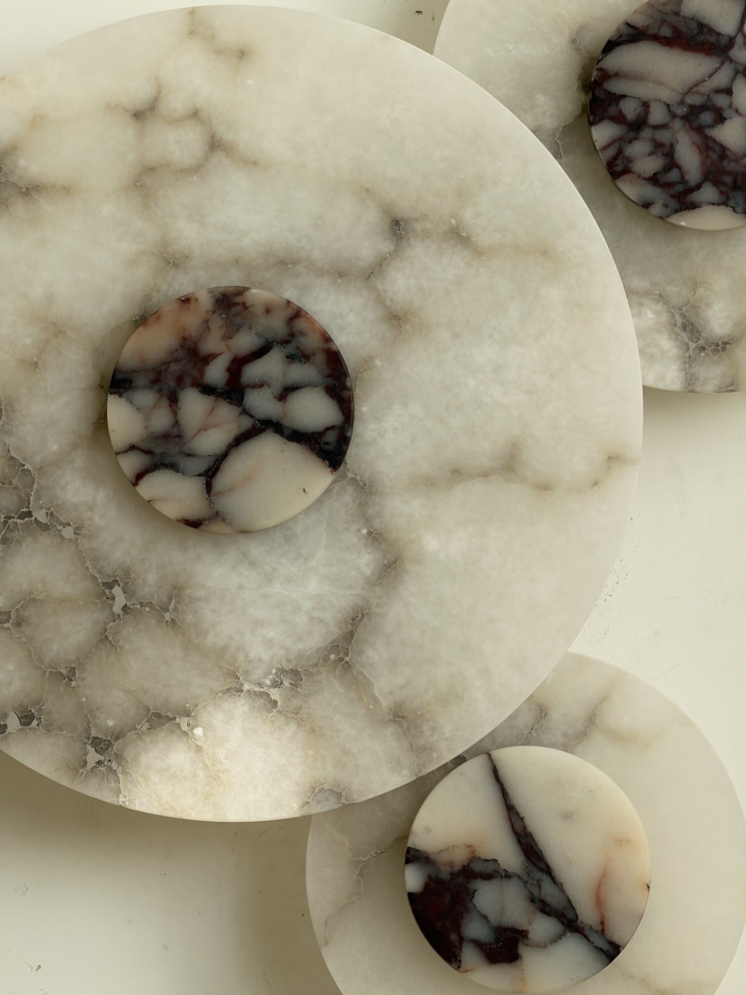 The warm, diffused glow from the Median Alabaster Wall Lamp.