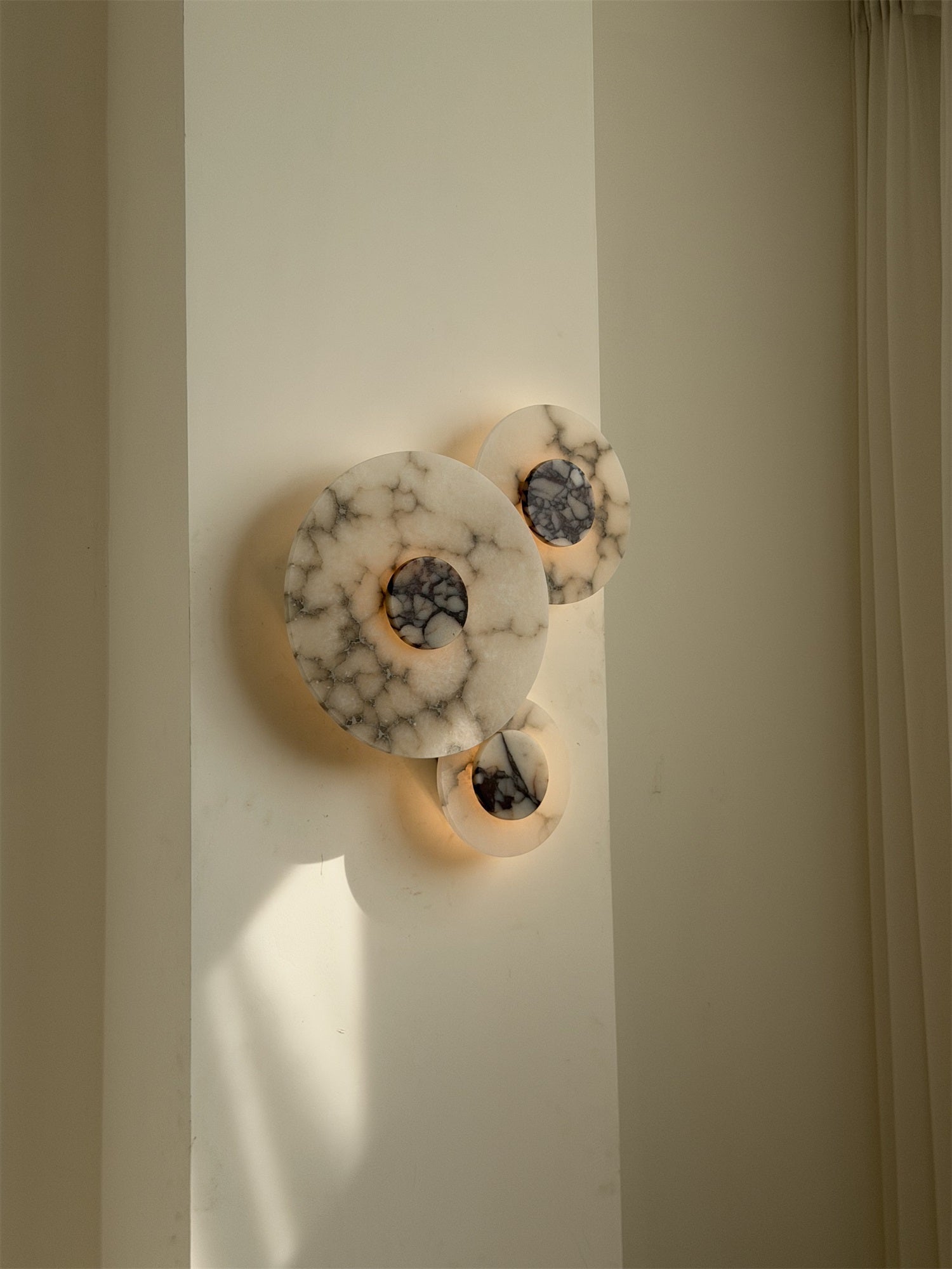Purple Median Wall Lamp, unlit, showing its rich color.